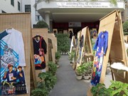 Contemplating Vietnam's natural, cultural heritages on traditional gowns