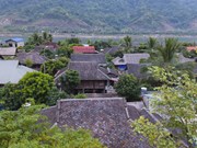 Stone-roofed stilt houses in Dien Bien province