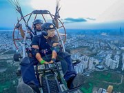 Admiring Ho Chi Minh City while paragliding