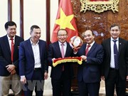 President receives football head coaches