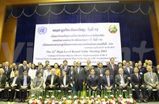 Laos opens round-table meeting to boost development 