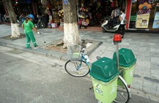 Hanoi trash collectors using bikes