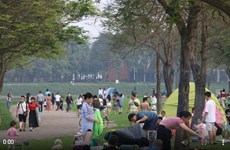 People enjoy the national holiday in the largest park in Hanoi