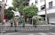 Hanoi police fines people traveling without required documents