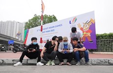 Young people excitedly watch e-sports at the 31st SEA Games