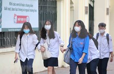 Students in Hanoi back to school after three months off