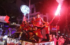 Football fans storm streets to celebrate U23 victory