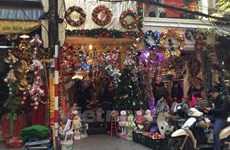 Christmas decorations adorn market