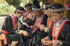 Red Dao people preserving beauty of traditional outfits
