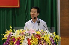 Vietnam, Laos Parties share experience in sustainable development 