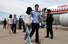 Cambodia deports 61 Chinese telecom fraud suspects home 
