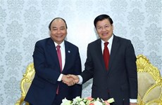 Vietnamese, Lao PMs visit Star Telecom