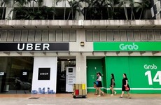 Singapore sets interim measures for Grab-Uber merger