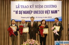 20 individuals presented with UNESCO Vietnam insignia