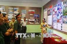Exhibition showcases efforts to revive land polluted by UXO, chemicals 