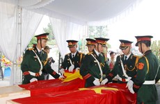 Quang Tri reburies martyrs’ remains repatriated from Laos