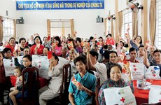 VN Red Cross hailed for two decades of Tet relief for the poor, AO victims