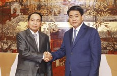Hanoi, Lao officials share experiences in inspection work