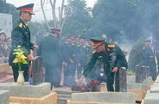 Reburial service held for soldier remains repatriated from Laos