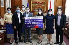Vietnamese overseas in Laos contribute to COVID-19 vaccine fund