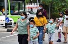 Singapore’s COVID-19 control measures pose uneven effect on families
