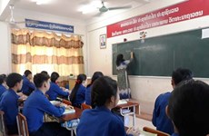 Dien Bien province presents school to Lao locality  