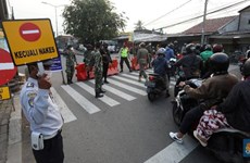 Indonesia extends ongoing public activity restrictions for additional two weeks