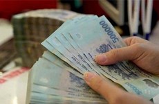 Reference exchange rate down 15 VND at week’s beginning 