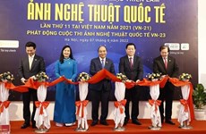 President Nguyen Xuan Phuc attends 11th International Art Photo Exhibition