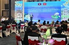 Hanoi, Vientiane promote cooperation in investment, trade, tourism