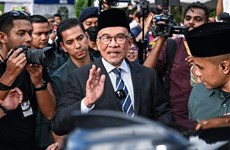 New Malaysian PM pledges to balance all interests