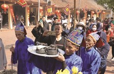 Villagers continue traditional rice cooking contest