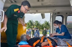Fisherman with stroke brought from Song Tu Tay island to mainland for treatment