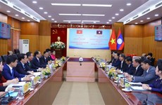  Vietnam, Laos share experience in religious affairs