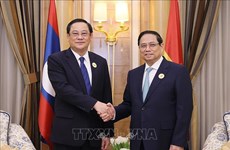 PM Chinh meets with Lao counterpart in Saudi Arabia