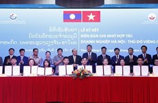 Vietnamese, Lao capital cities ink deals to boost trade