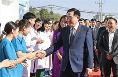 Vietnamese, Lao NA leaders meet T78 Friendship School's former teachers, students