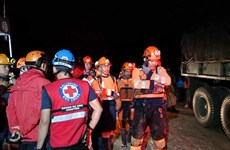 Landslide buries two buses in Philippines, injuring many
