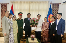 Vietnamese diplomats extend greetings to Lao Embassies in Belgium, Cuba on Bun Pi May festival