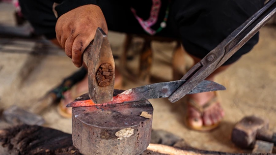 Hmong ethnic people preserving traditional blacksmithing