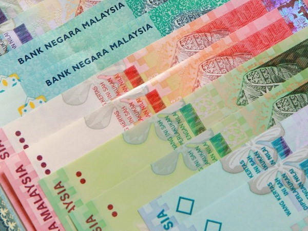 Malaysia’s ringgit continues tumbling against greenback hinh anh 1
