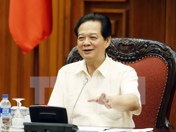 PM chairs meeting on impacts from China’s devaluation of yuan hinh anh 1