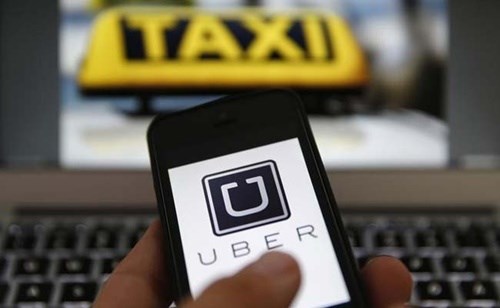 Taxi company Uber Vietnam cuts fares hinh anh 1