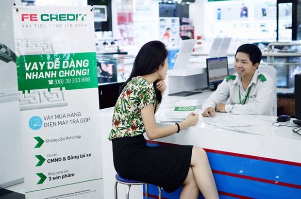 FE CREDIT signs loan contract with Credit Suisse hinh anh 1