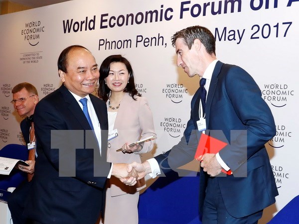 Prime Minister wraps up activities at WEF-ASEAN 2017 hinh anh 1
