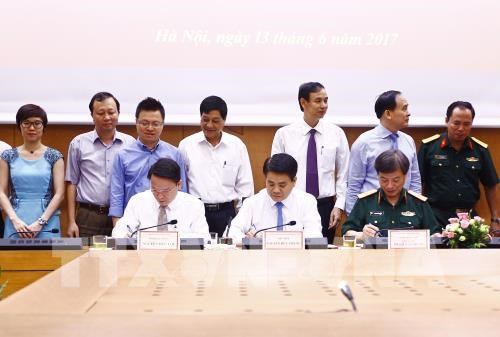 Hanoi, Vietnam News Agency ink cooperation deal hinh anh 1