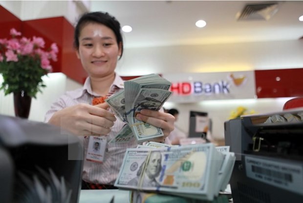 Reference exchange rate goes down by 1 VND hinh anh 1