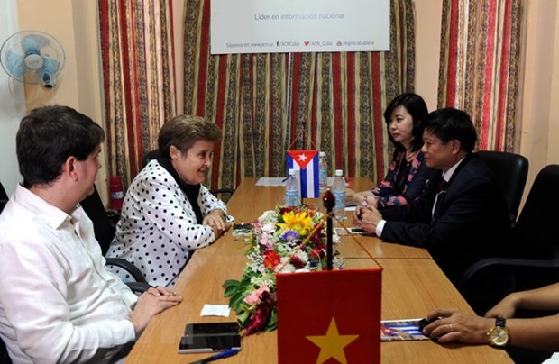 Vietnam News Agency steps up partnership with Prensa Latina, ACN hinh anh 2