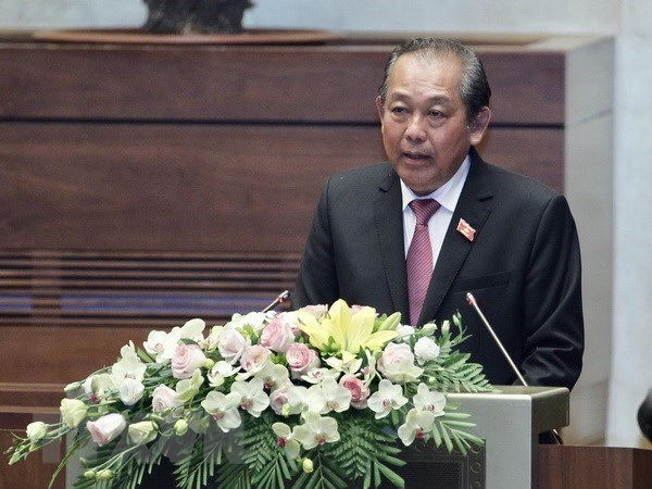 Deputy PM stresses need to improve national competitiveness at NA session hinh anh 1