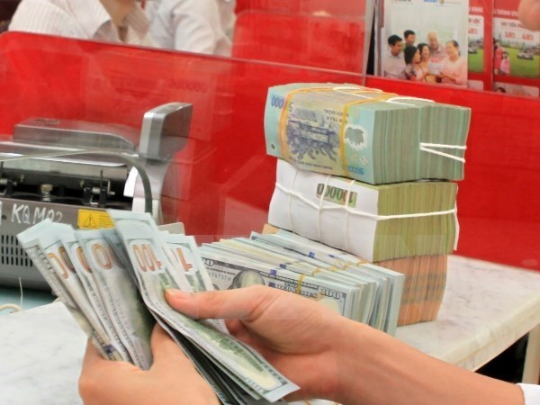 Reference exchange rate revised down 5 VND hinh anh 1
